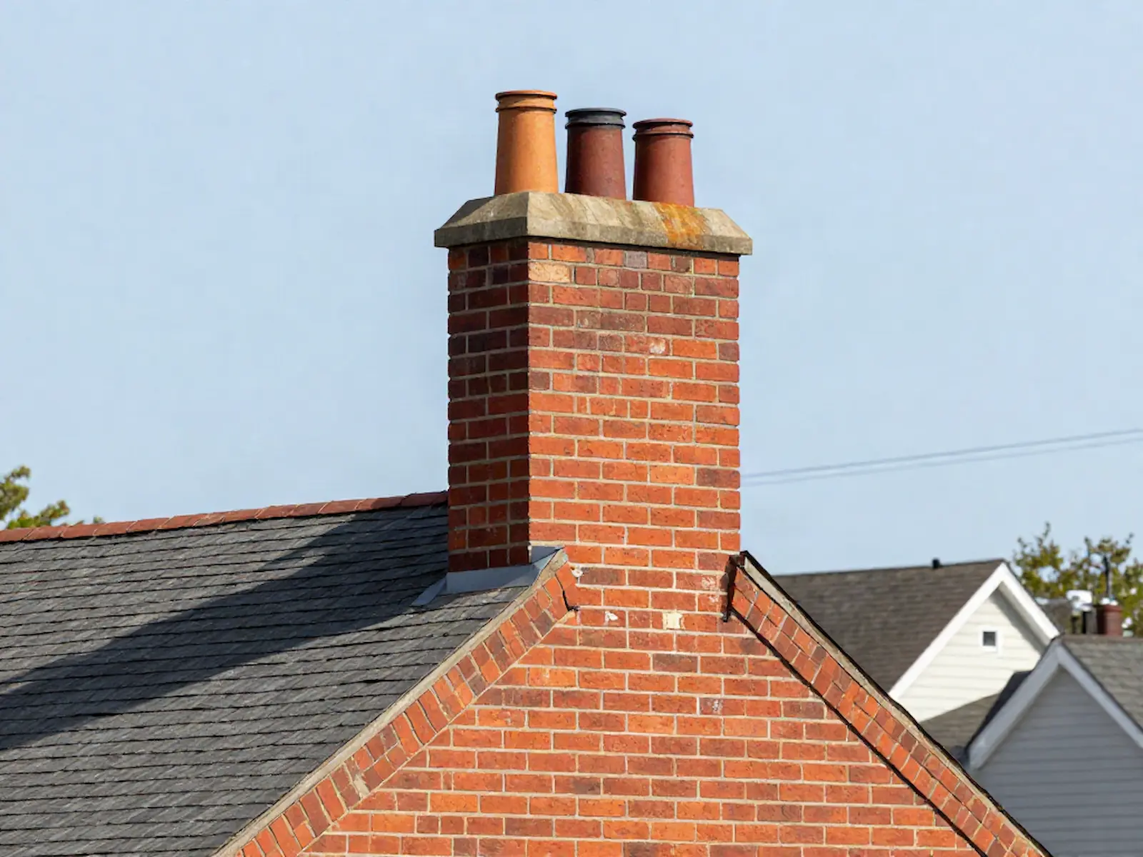 Brick chimney on a home served by Grassy Lake Chimney Sweeps in Chicago, IL